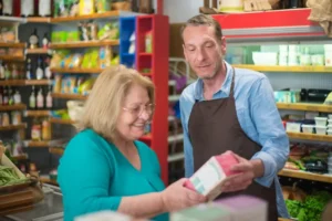 Store clerk helping a woman in a shop