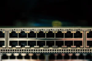Close-up of a network switch with numbered ports and small lights